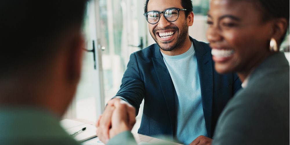 Business people and handshake with welcome in office for b2b upsell opportunity and contract agreement success Internal collaboration happy account manager and shaking hands for client onboarding